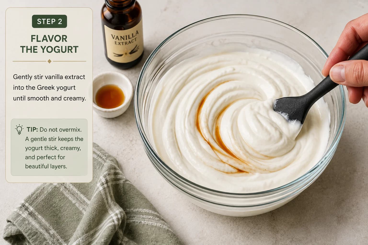 Greek yogurt being gently mixed with vanilla extract in a bowl until smooth and creamy.