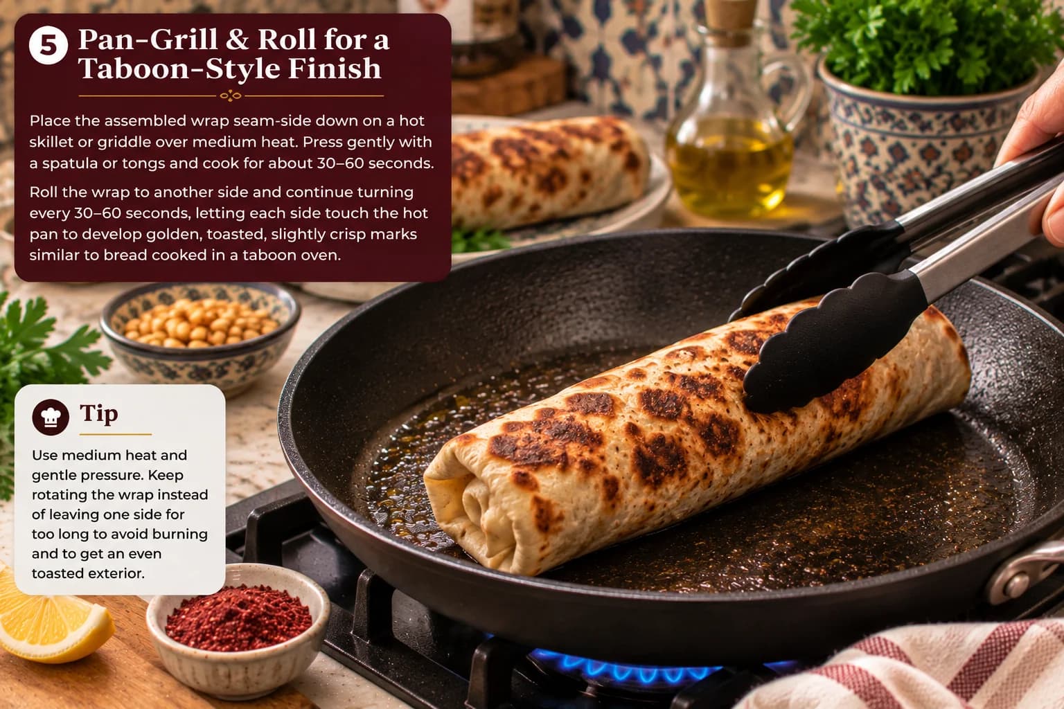 Assembled Palestinian Musakhan chicken pita wrap being gently rolled and pressed on a hot pan to create a rustic taboon-style toasted exterior.