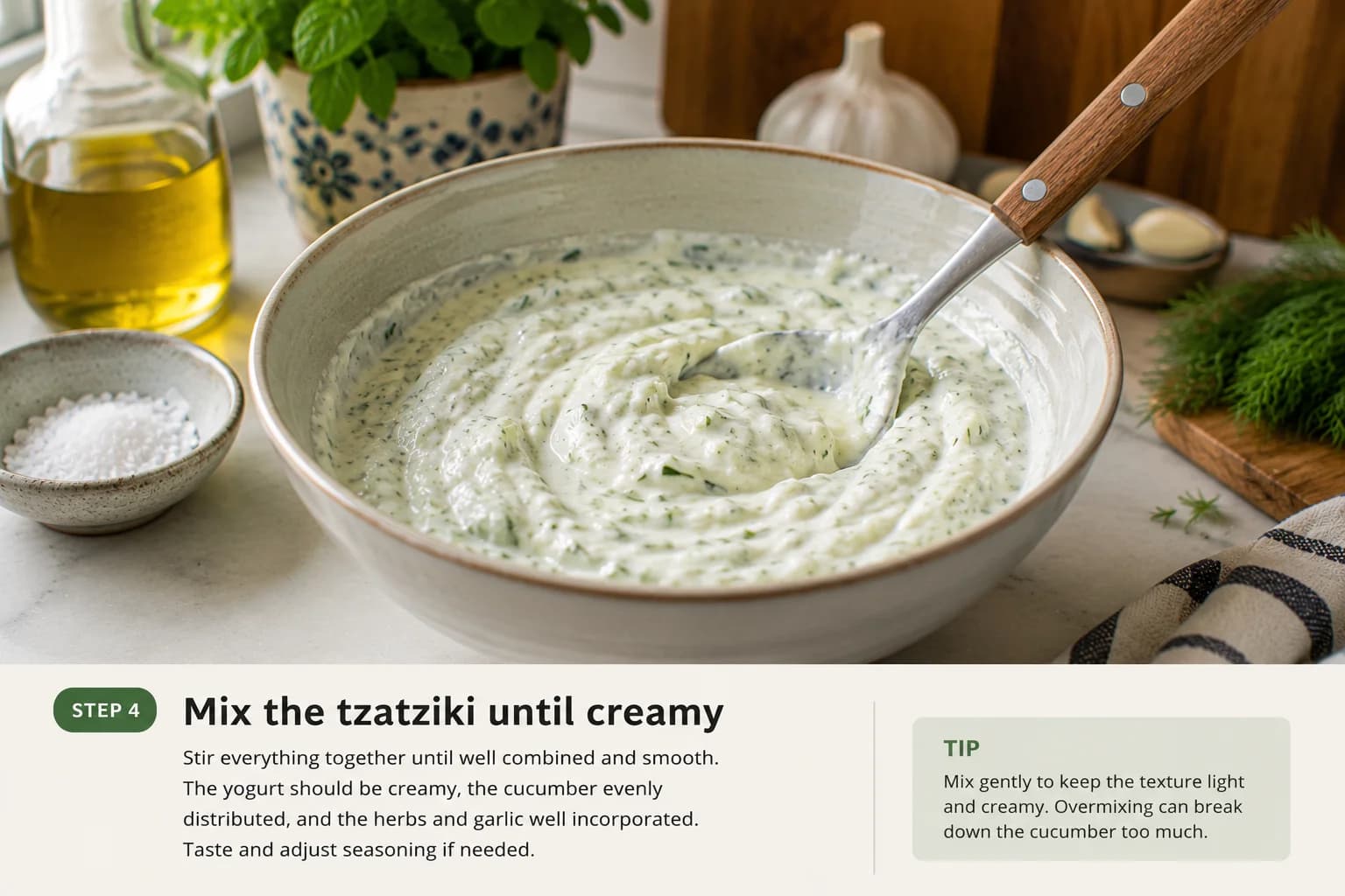 Creamy Lebanese-style tzatziki being gently mixed until the cucumber and herbs are evenly distributed.