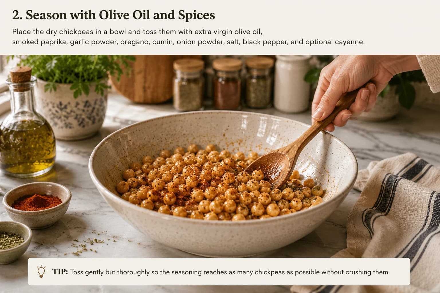 Dry chickpeas being coated with extra virgin olive oil and Mediterranean spices in a stylish kitchen.