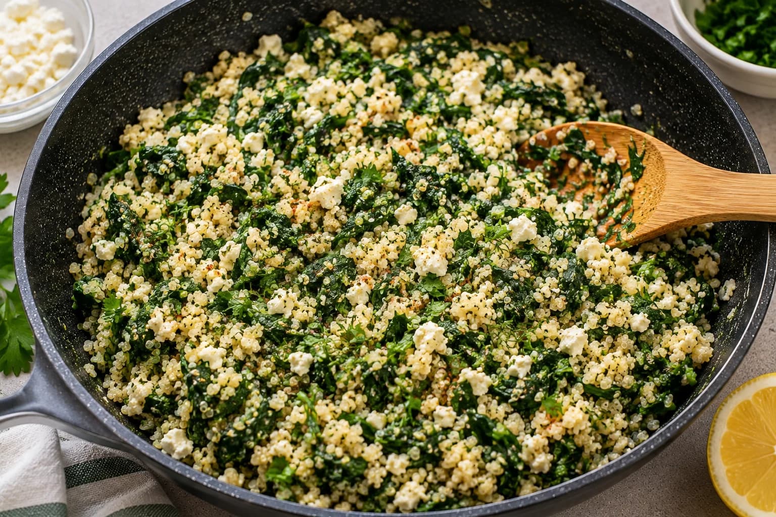 Quinoa, spinach, feta, herbs, lemon, and Parmesan combined into a savory zucchini boat filling.